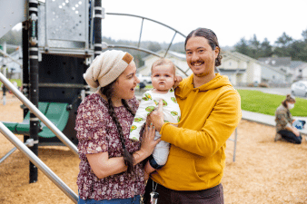Young parents with a baby at Valley West Park